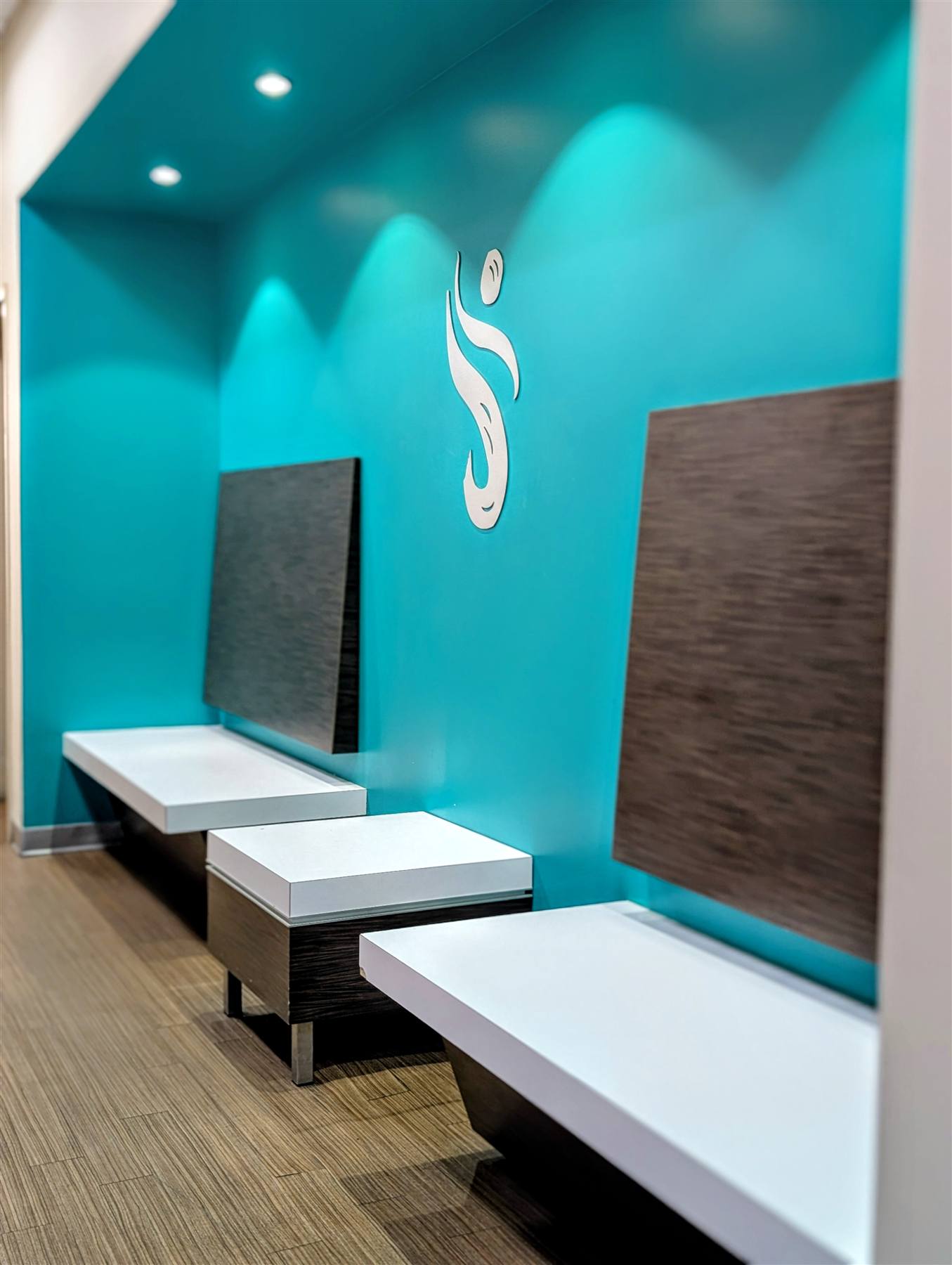 The clean, branded locker room corridor at VIVE Health & Fitness